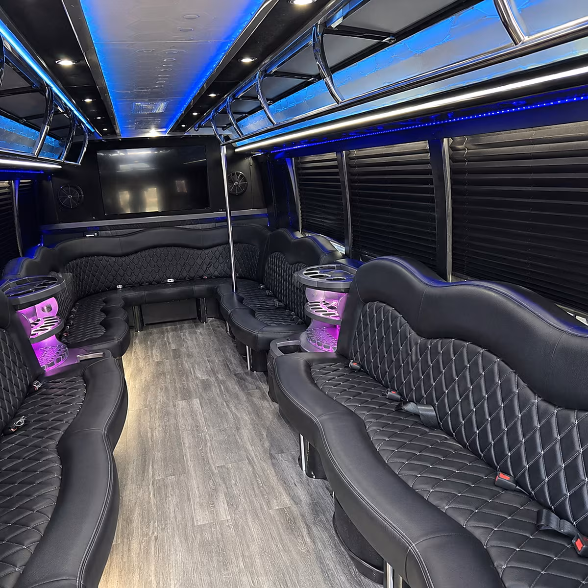 Friends laughing during a party bus celebration in San Diego
